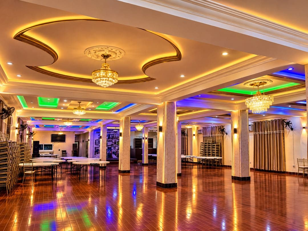 The JC Banquet Hall with chandeliers, marble columns and a polished floor